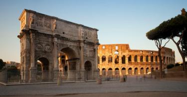 Arch of Constantine and Colosseum at sunset, Rome, Italy