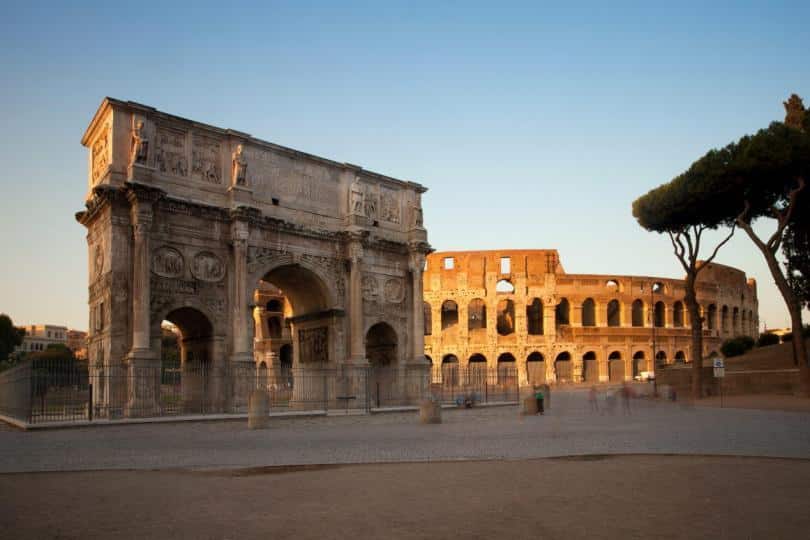 Arch of Constantine and Colosseum at sunset, Rome, Italy