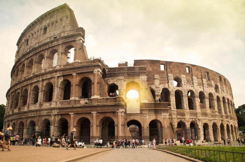 The colosseum background in the morning scene is a landmark in Rome of Italy that is an one of amazing fascinate of 7 wonder places in the world for traveling in summer