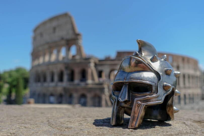 Gladiator mask in front of Colosseum in Rome, Italy