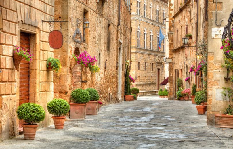 Things to do in Tuscany - Colorful street in Pienza, Tuscany, Italy
