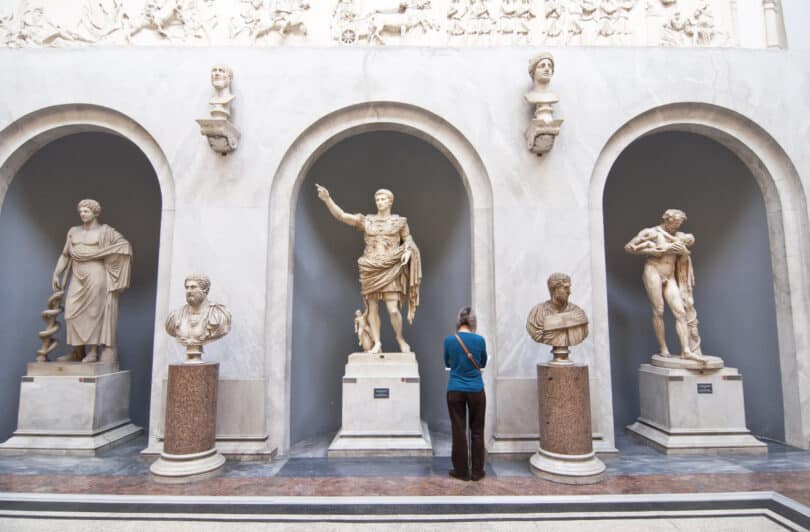 Tourists visiting the statues in the halls of the Vatican Museums in Rome, Italy
