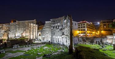Forum of Augustus and Forum Hotel lit up at night. Beautiful night cityscape suitable for backgrounds.