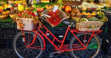 Red old bike in market on Campo di Fiori, Rome, Italy. Rome market on Piazza Campo di Fiori is landmark of Rome.