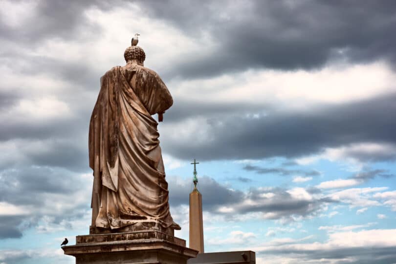 Rome Angels and Demons Guided Half-Day Tour - The back of the Saint Peter statue and the obelisk outside the Papal Basilica of Saint Peter