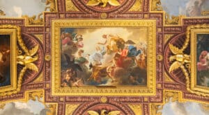 Ornate Baroque ceiling fresco with painted figures and decorative framing
