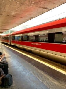 The red Frecciarossa high-speed train waiting at the Rome Termini station